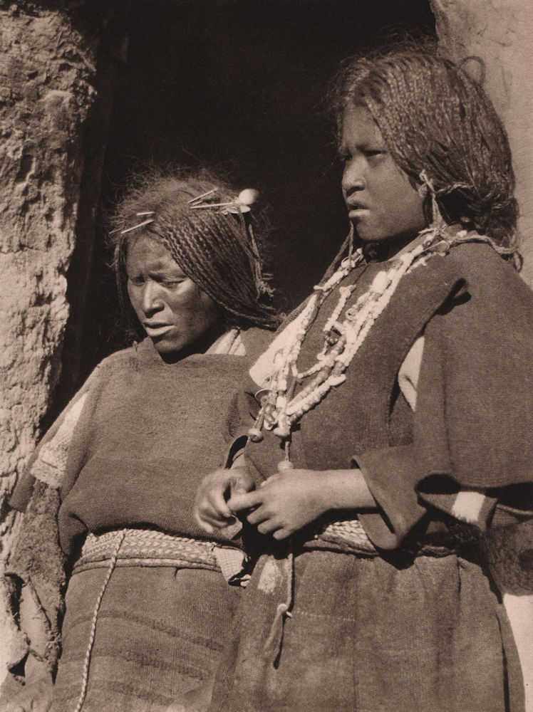 A Chipaya woman with her daughter in front of their hut. Bolivia 1928 print