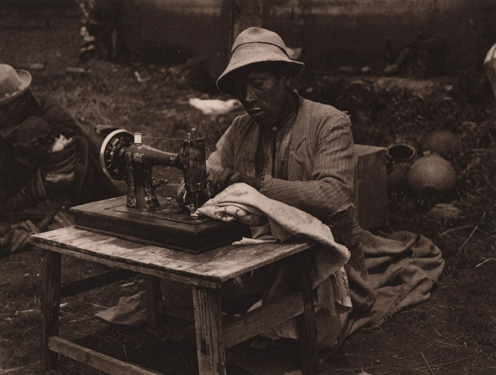Aymara Indian making shirts from flour bags. Sewing machine. Bolivia 1928